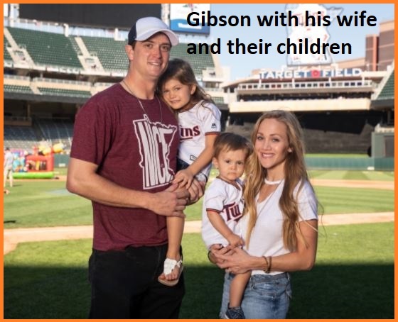 Kyle Gibson with his wife and their children